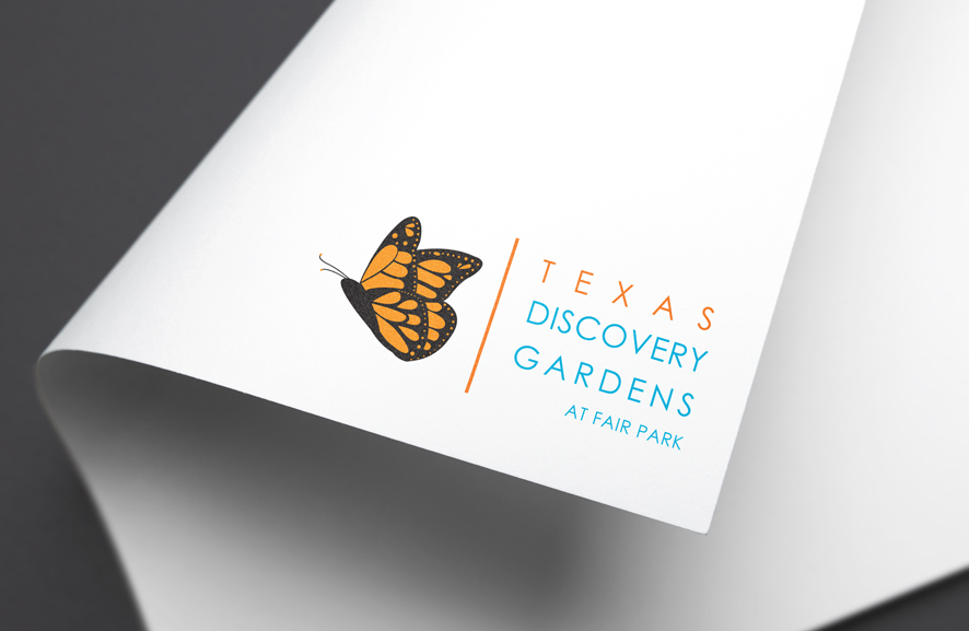 monarch butterfly with texas discover gardens at fair park logo on a corner piece of paper.